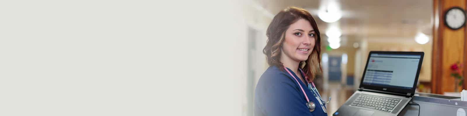 A nurse on a computer at Yuba City
